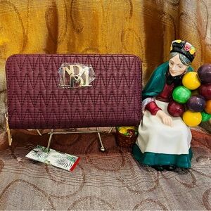 BADGLEY MISCHKA ZIP AROUND WALLET in Eggplant color…. NWT
Spot for Cellphone